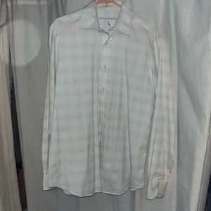 White with little light blue stripes. Men’s button down
